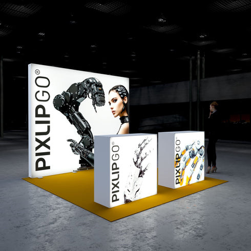 A side perspective of the Pixlip GO booth highlighting its illuminated design. The central panel showcases a robotic arm and a futuristic woman, while the counters present bold robotic graphics. The setup is sleek and visually striking with its yellow flooring and high-tech aesthetic.