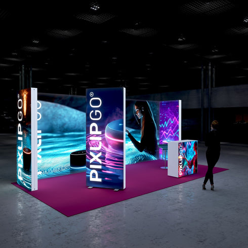A side view of the exhibition stand, highlighting the depth of the illuminated displays. The combination of vibrant colors and modern design conveys a professional and forward-thinking image. A man stands in front of the stand, observing the presentation.