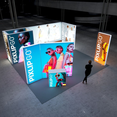 A vibrant exhibition stand featuring illuminated displays with stylish models wearing modern sunglasses and bright neon colors. The setup includes a bold blue panel with three fashionable women, a smaller display with a model in sunglasses, and a tall orange panel showcasing a chic handbag.